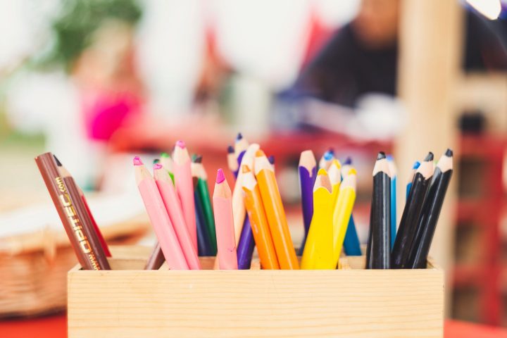 colored pencils in a wooden box