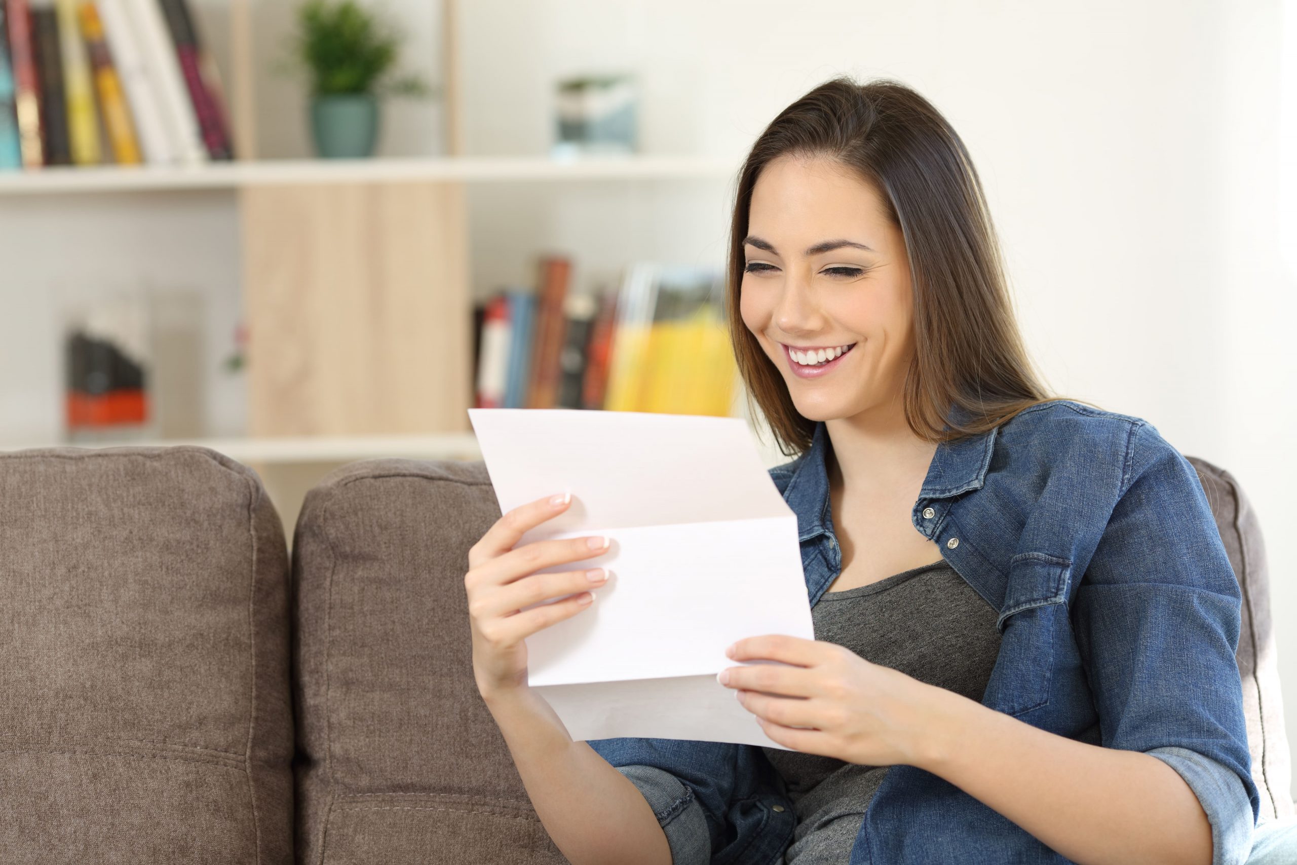 woman reading a direct mail